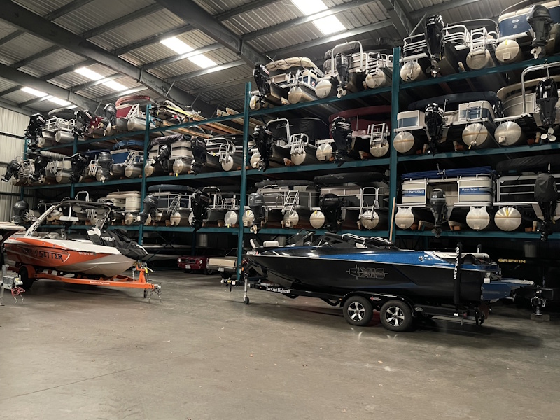 Malibu and Axis wake boats beneath the storage racks
