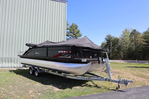 Black Barletta pontoon boat at the yard