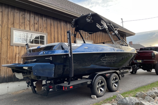 Boat on a trailer behind a pickup truck
